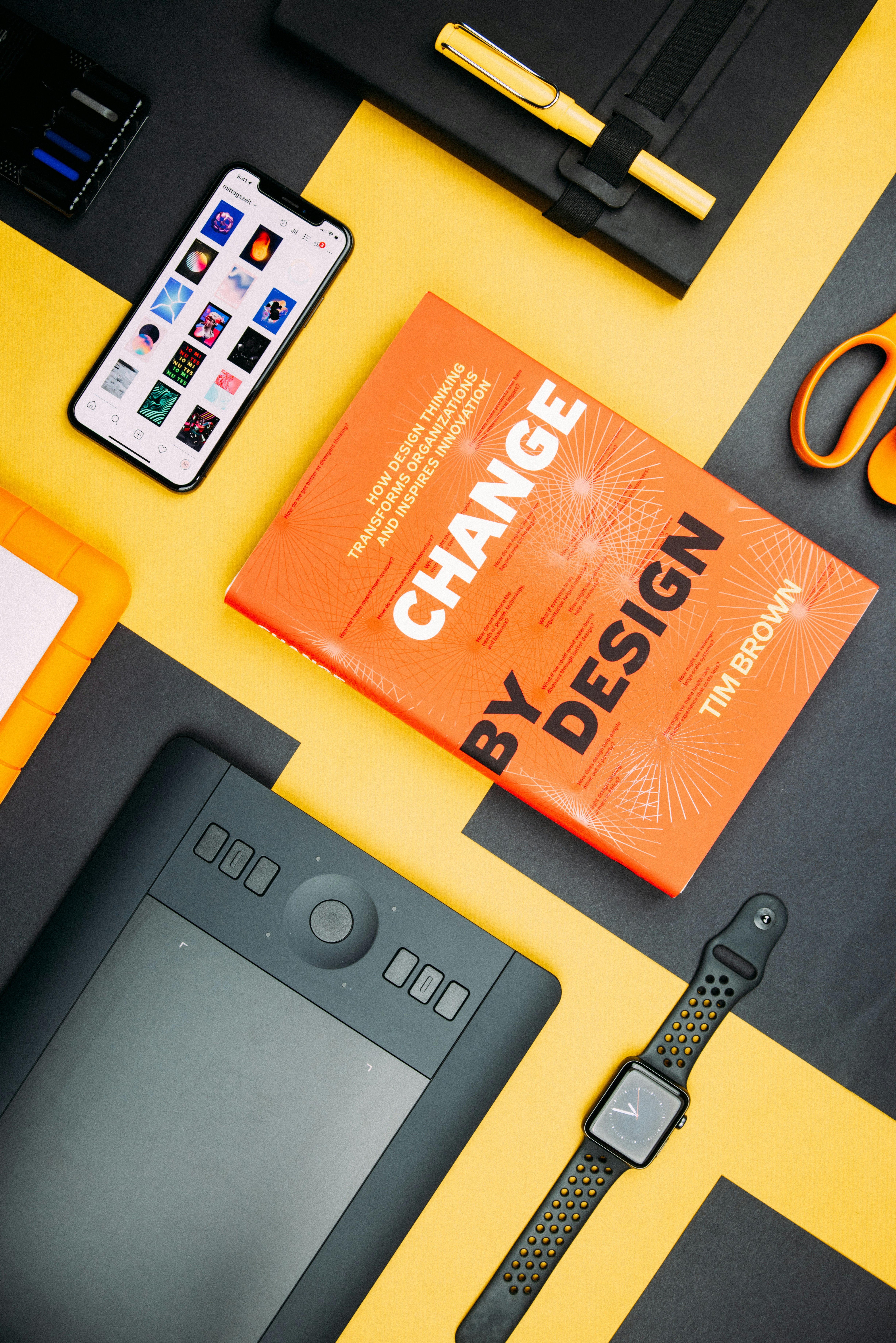 Creative design workspace with books and design tools